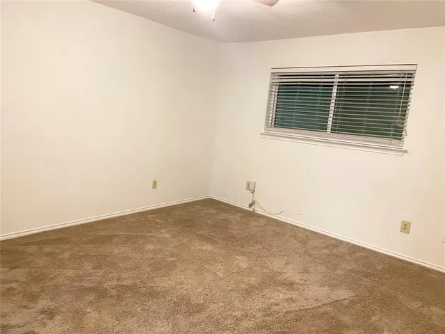 a view of empty room with windows