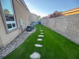 a view of an house with backyard space and sitting area