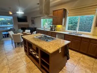 a kitchen with a stove a sink and a refrigerator