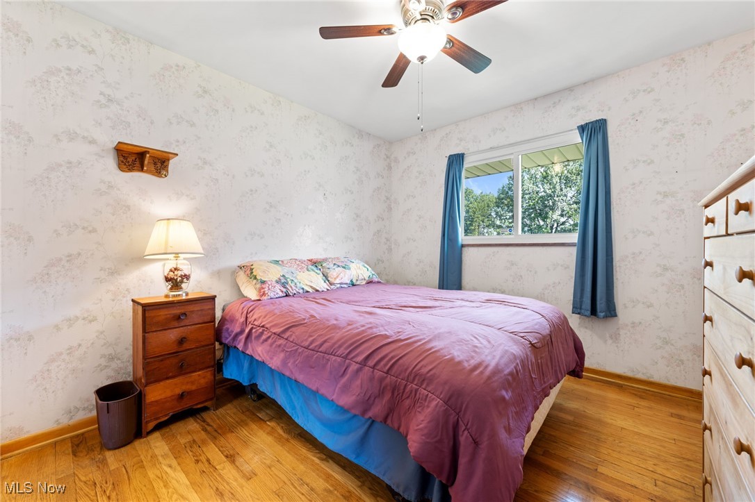 7702 Ragall Parkway Cleveland, OH 44130 - Photo 19 of 41 Bedroom featuring ceiling fan and hardwood / wood-style flooring