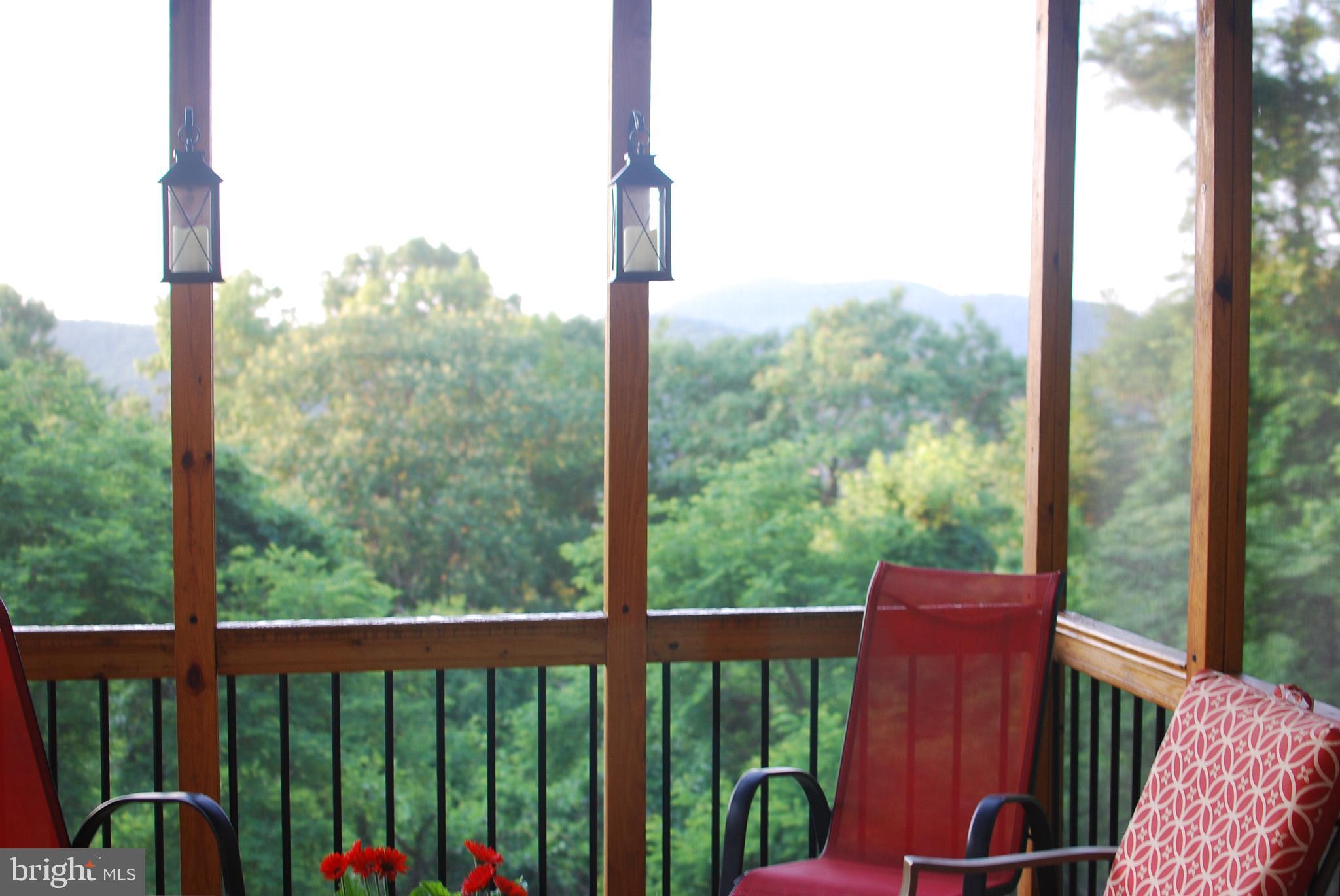 140 Arrowood Road Linden, VA 22642 - Photo 17 of 49 a view of a balcony with chairs