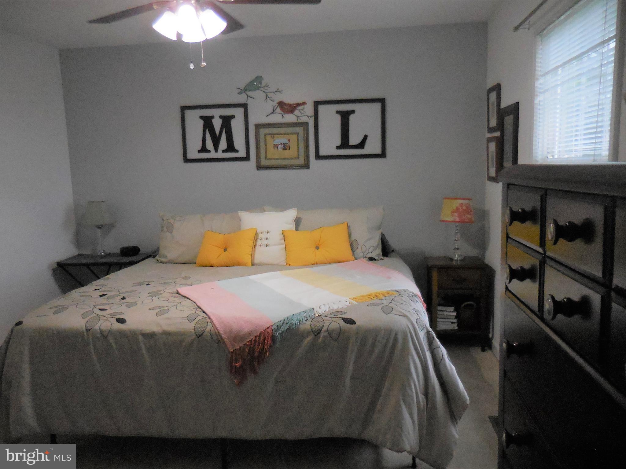 140 Arrowood Road Linden, VA 22642 - Photo 20 of 49 a bedroom with a bed and painting on the wall