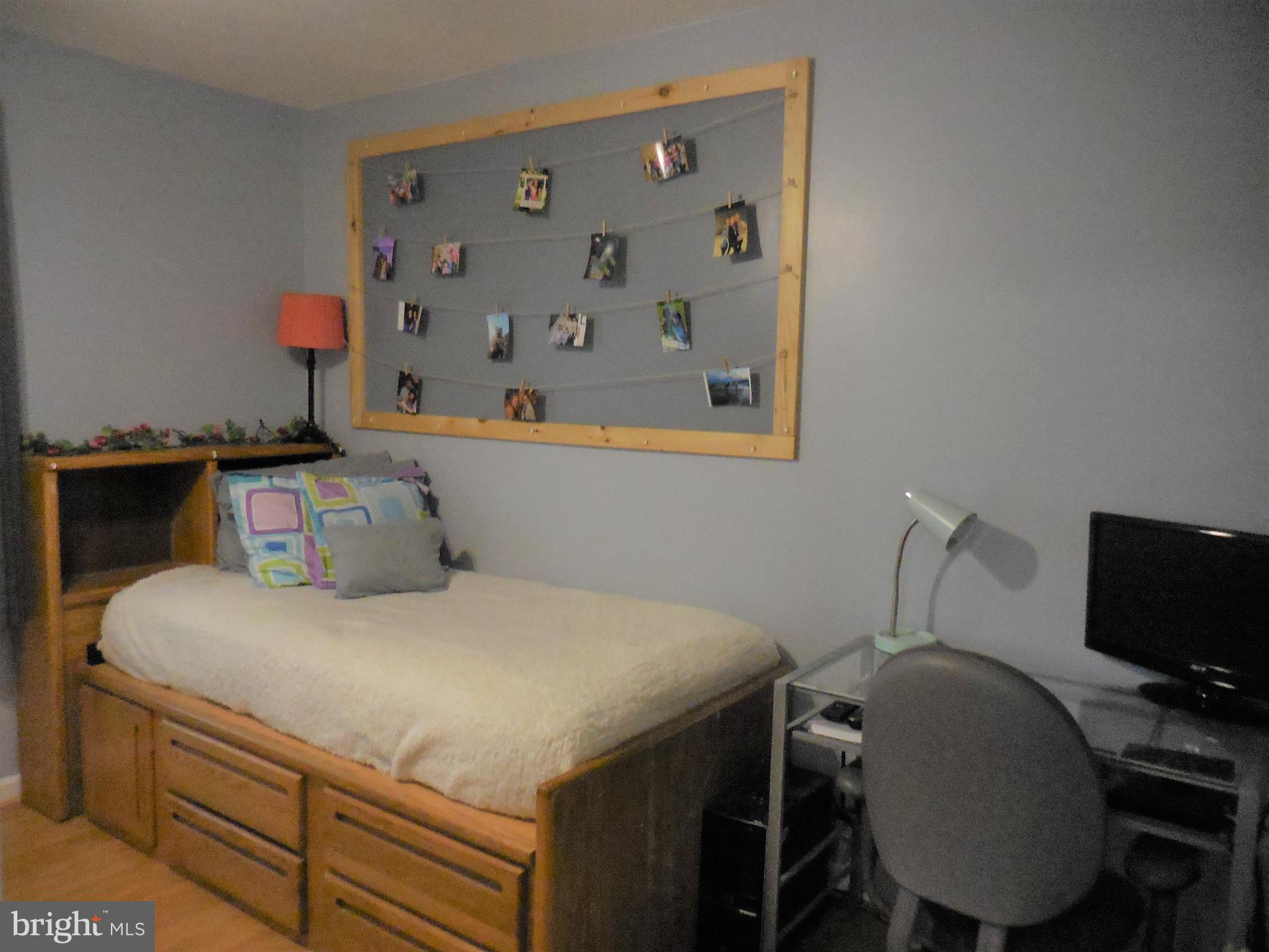 140 Arrowood Road Linden, VA 22642 - Photo 27 of 49 a bedroom with a bed and a flat screen tv