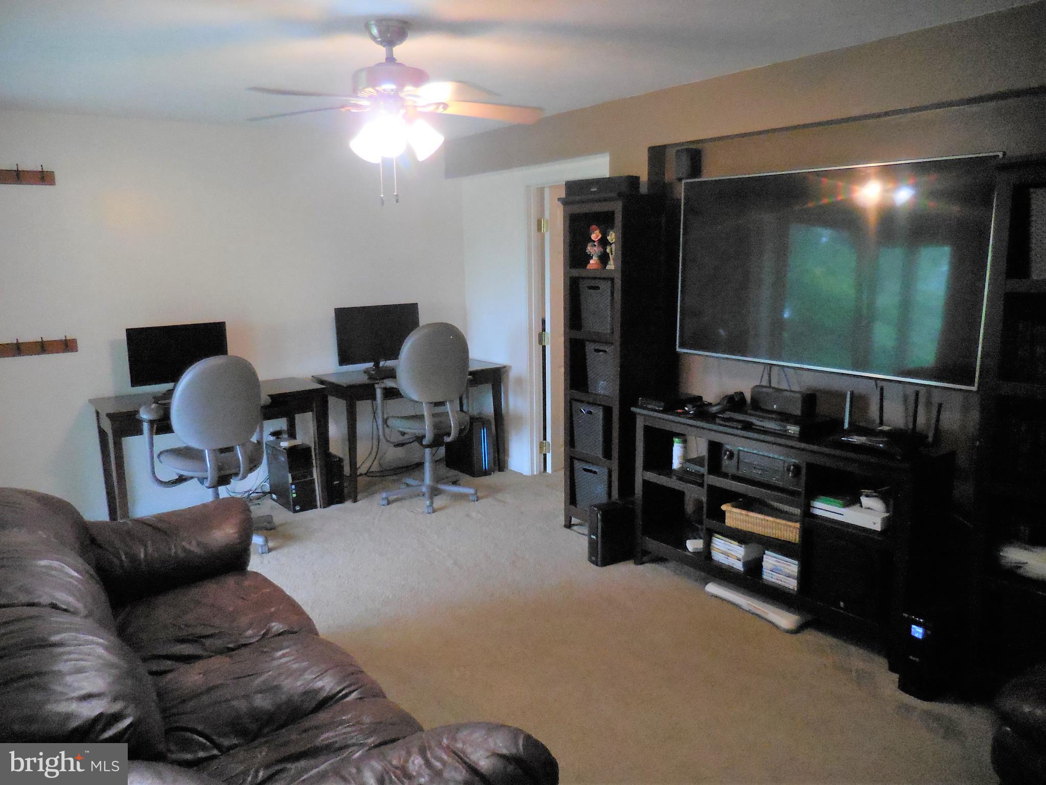 140 Arrowood Road Linden, VA 22642 - Photo 28 of 49 a living room with furniture and a flat screen tv