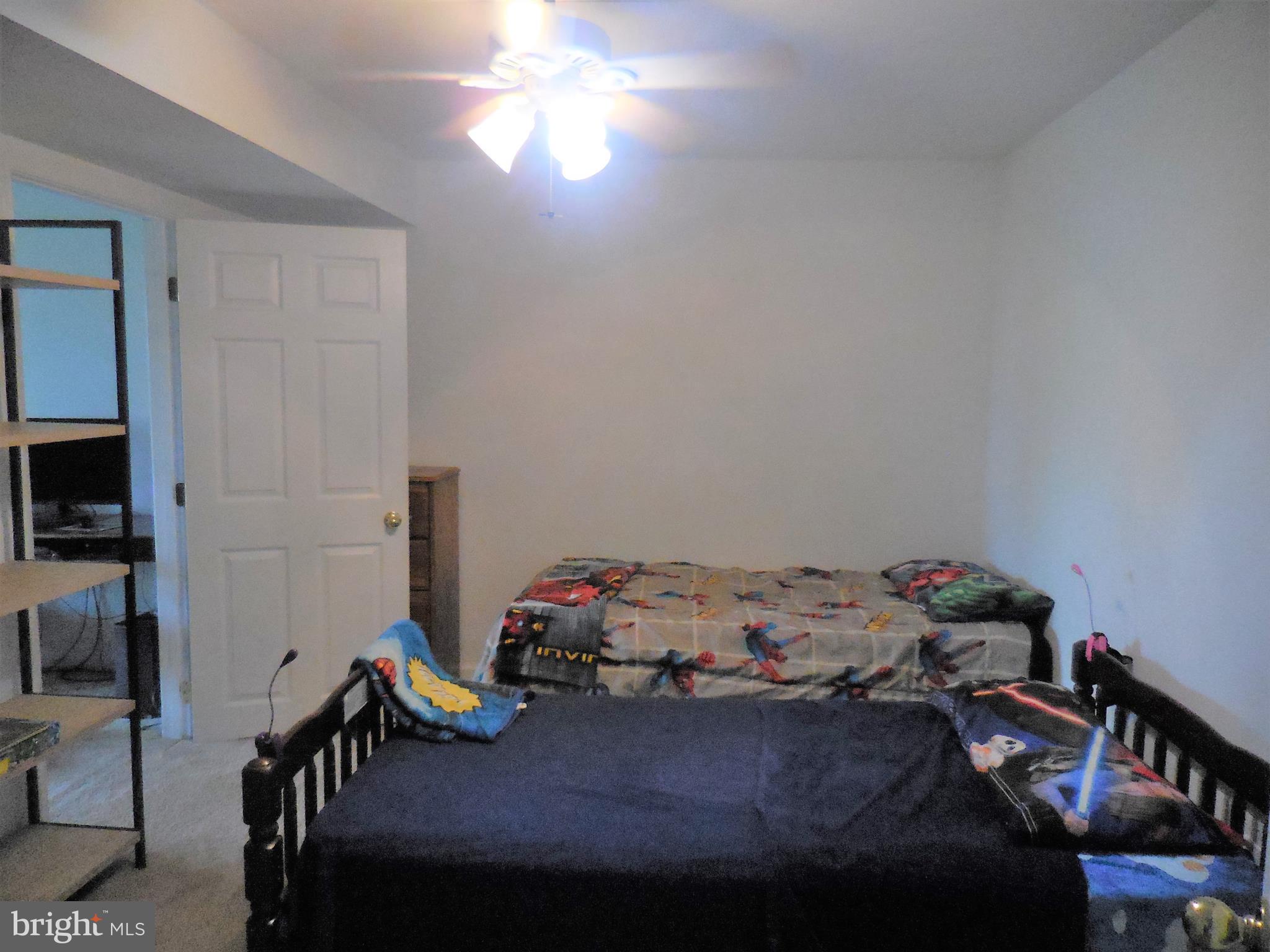 140 Arrowood Road Linden, VA 22642 - Photo 29 of 49 a bedroom with a bed and a tv
