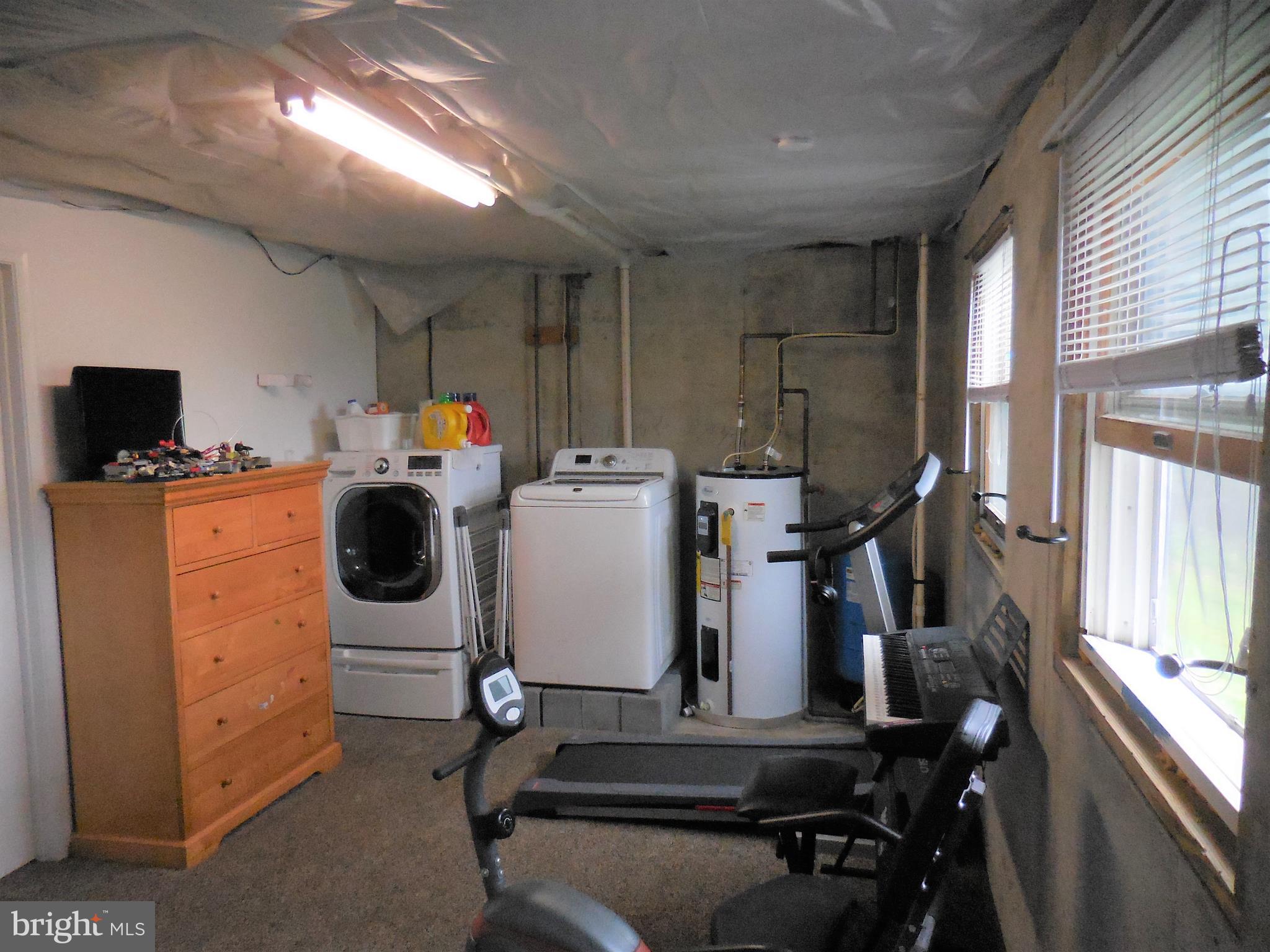 140 Arrowood Road Linden, VA 22642 - Photo 32 of 49 a utility room with dryer and washer