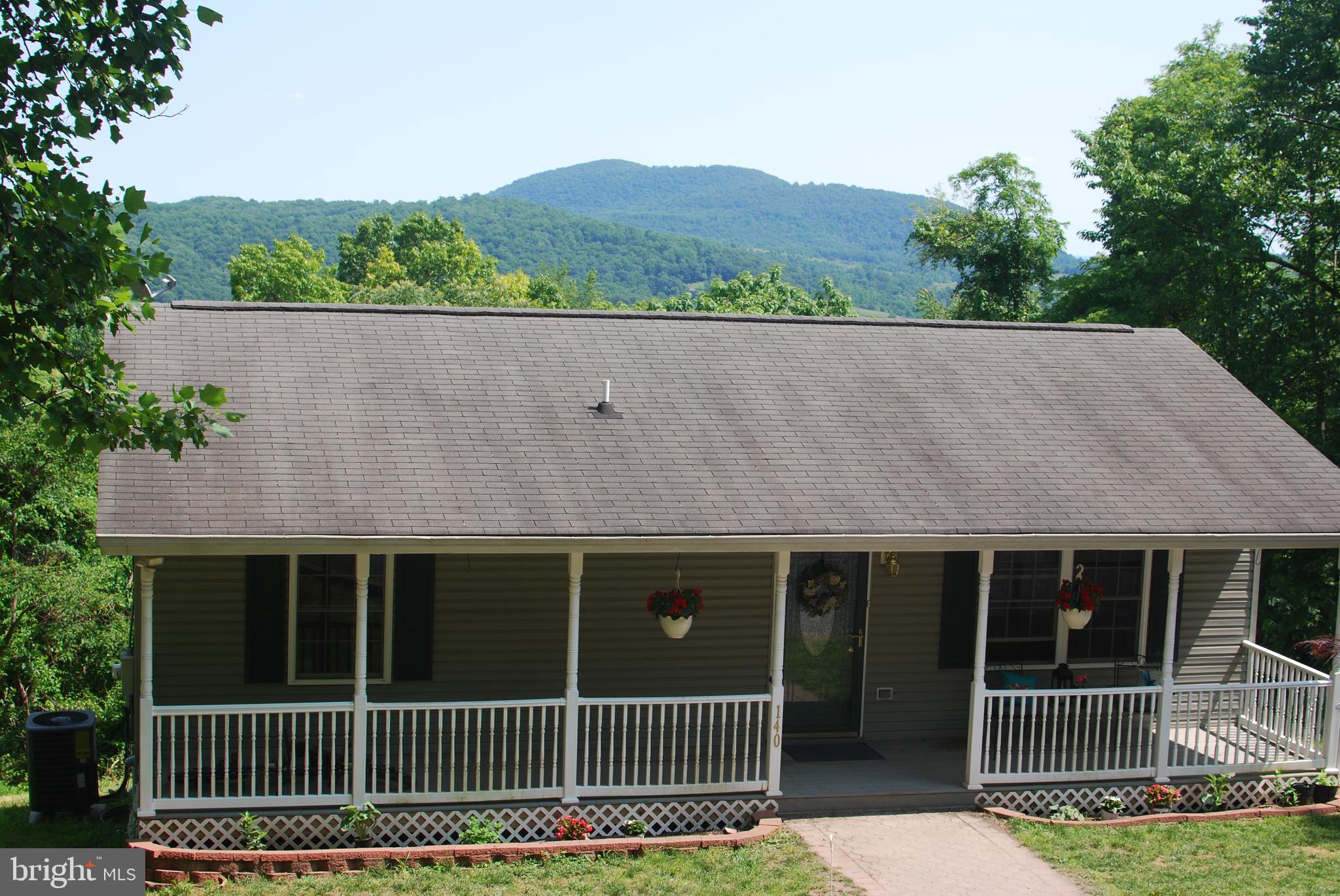140 Arrowood Road Linden, VA 22642 - Photo 40 of 49 a view of a house with a yard