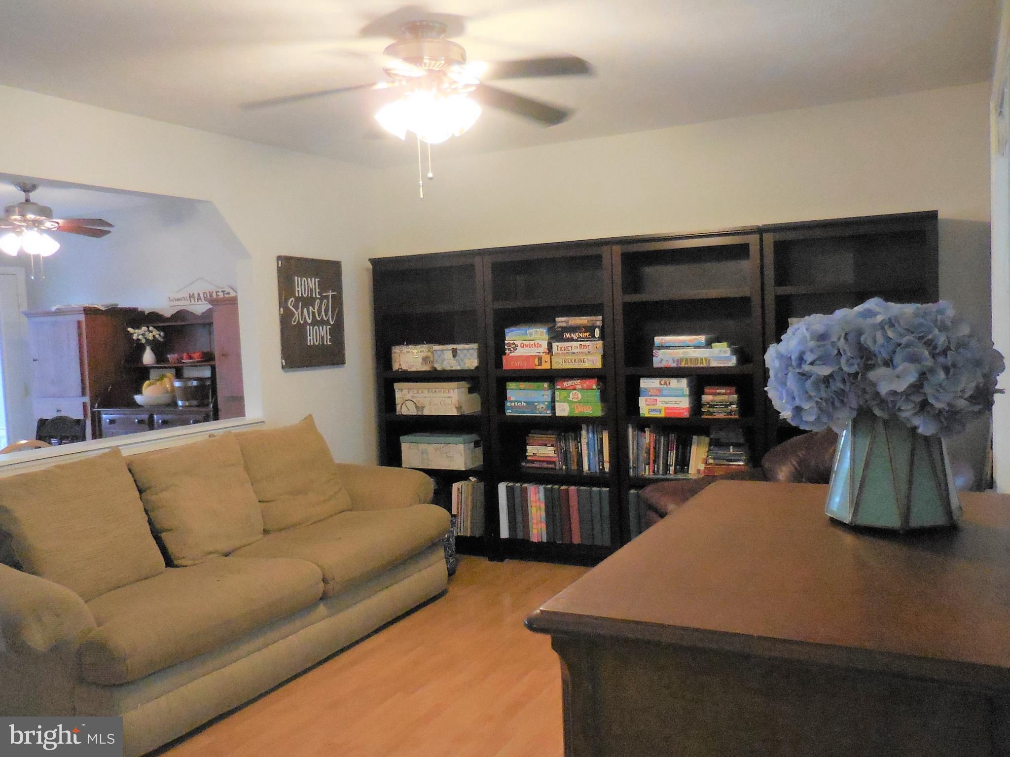 140 Arrowood Road Linden, VA 22642 - Photo 7 of 49 a living room with furniture and a bookshelf