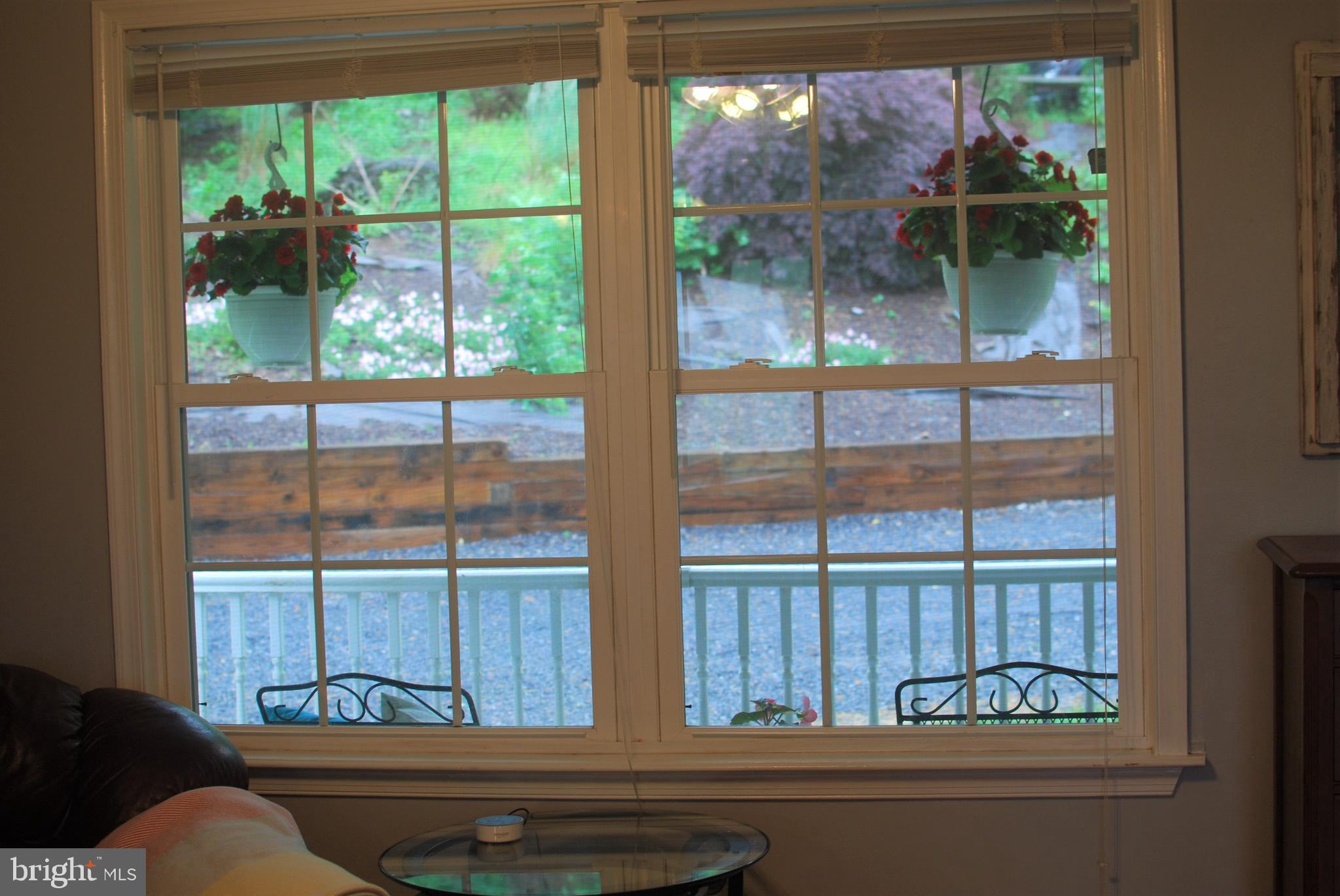 140 Arrowood Road Linden, VA 22642 - Photo 9 of 49 a living room with a floor to ceiling window and wooden floor