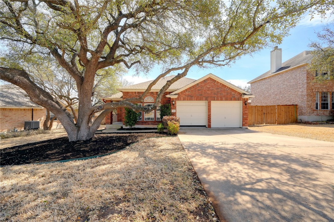 1204 Antelope Ridge Cedar Park, TX 78613 - Photo 1 of 1 a front view of a house with a yard covered in snow