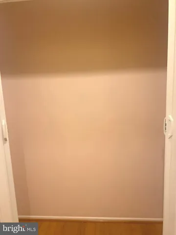 a living room with lots of furniture and a wooden floor