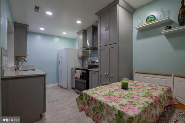 a view of staircase with wooden floor and white walls