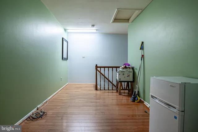 a bathroom with a granite countertop toilet and a sink