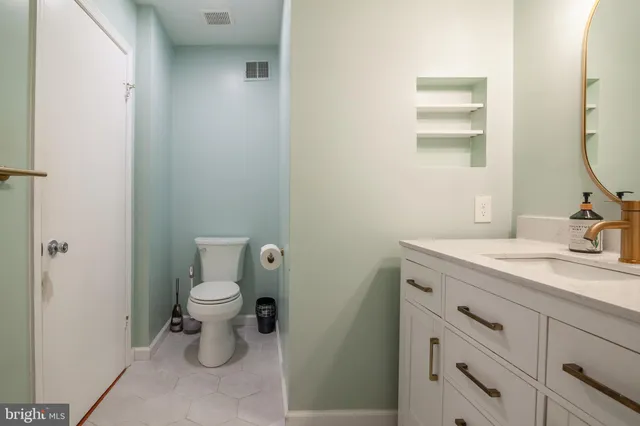 a stove top oven sitting inside of a kitchen