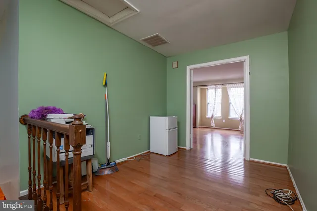 a kitchen with granite countertop a sink stove and refrigerator