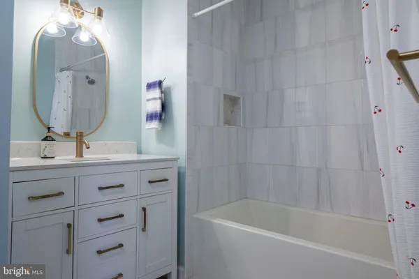 a view of storage and utility room with wooden floor