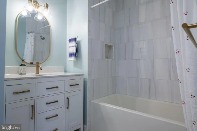 a view of storage and utility room with wooden floor