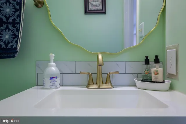 a bedroom with a bed and a wooden floor