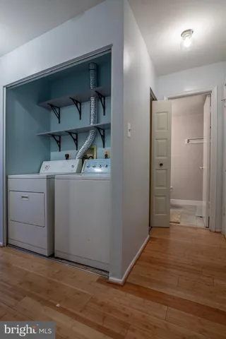 a view of hallway with wooden floor