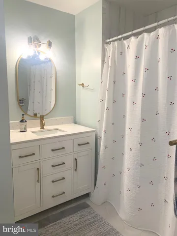 a bed sitting in a bedroom next to a lamp