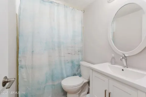 a bedroom with a bed and a table in it