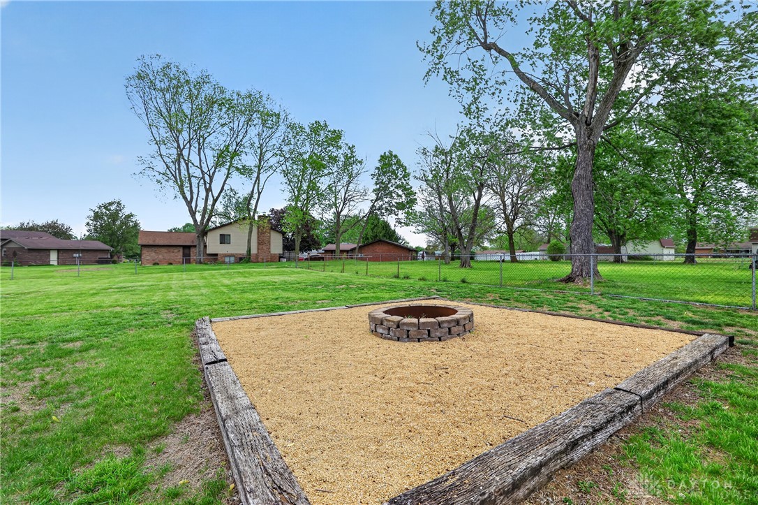 5741 Gray Road Fairfield, OH 45014 - Photo 31 of 32 This spacious yard offers ample green space and a dedicated fire pit area, perfect for outdoor enjoyment.