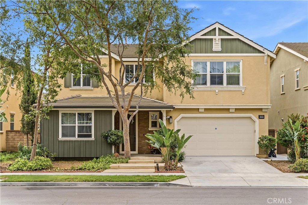 3380 Pine Ridge Loop Ontario, CA 91761 - Photo 1 of 37 a front view of a house with a yard