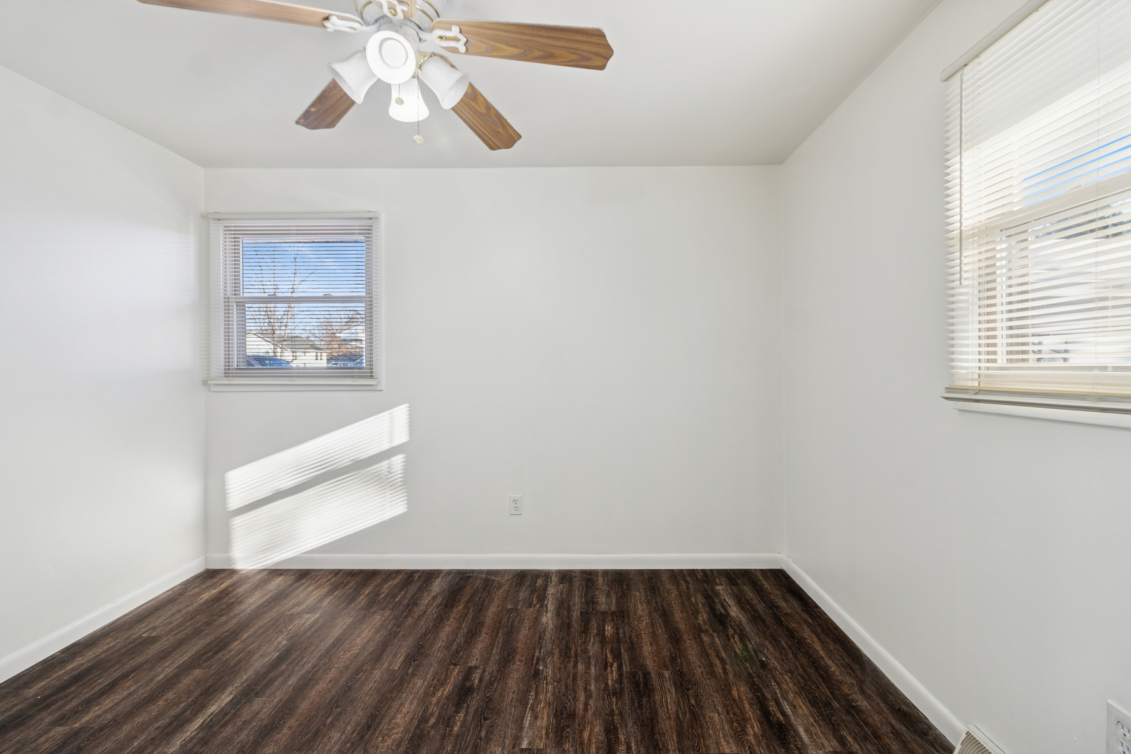 2420 Pecan Street Joliet, IL 60435 - Photo 16 of 20 wooden floor in an empty room with a window