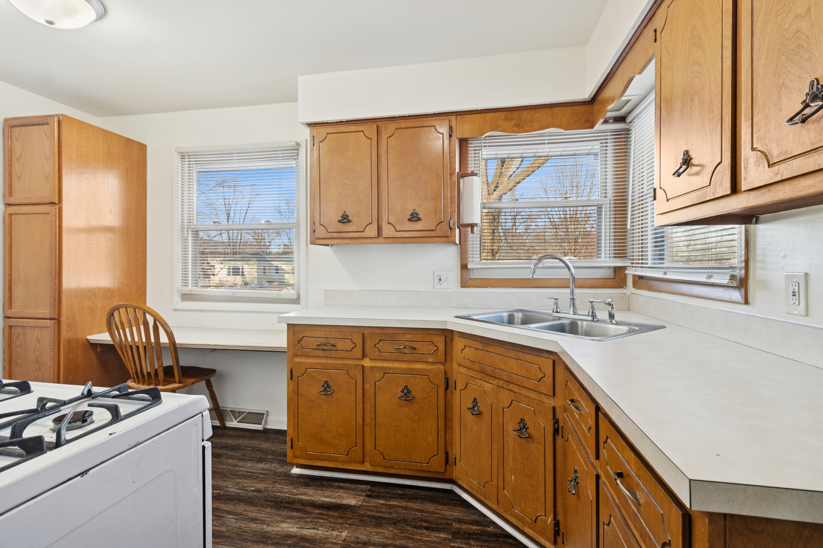 2420 Pecan Street Joliet, IL 60435 - Photo 9 of 20 a kitchen with stainless steel appliances granite countertop a sink stove and cabinets