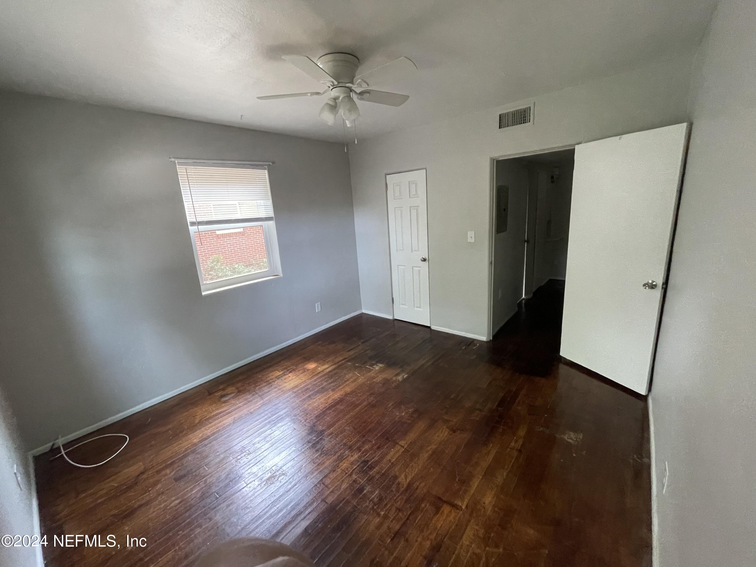 2117 Spring Park Road, Unit 2 Jacksonville, FL 32207 - Photo 6 of 9 a view of empty room with wooden floor