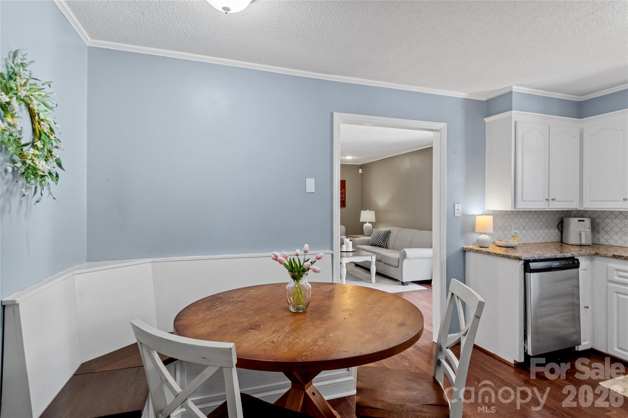 778 Reynolds Road Lewisville, NC 27023 - Photo 11 of 33 a dining room with furniture and wooden floor
