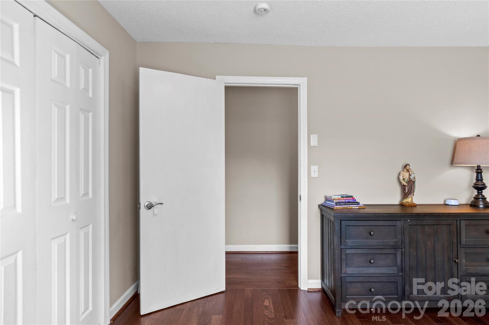 778 Reynolds Road Lewisville, NC 27023 - Photo 19 of 33 a view of a dresser with wooden floor