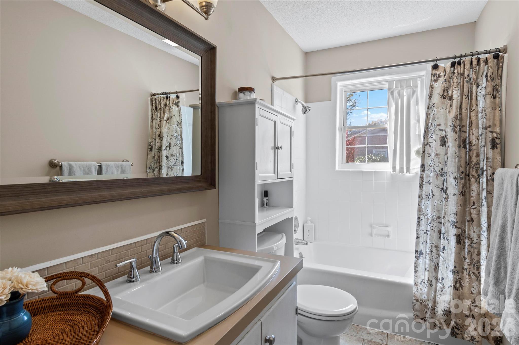 778 Reynolds Road Lewisville, NC 27023 - Photo 20 of 33 a bathroom with a sink toilet and shower