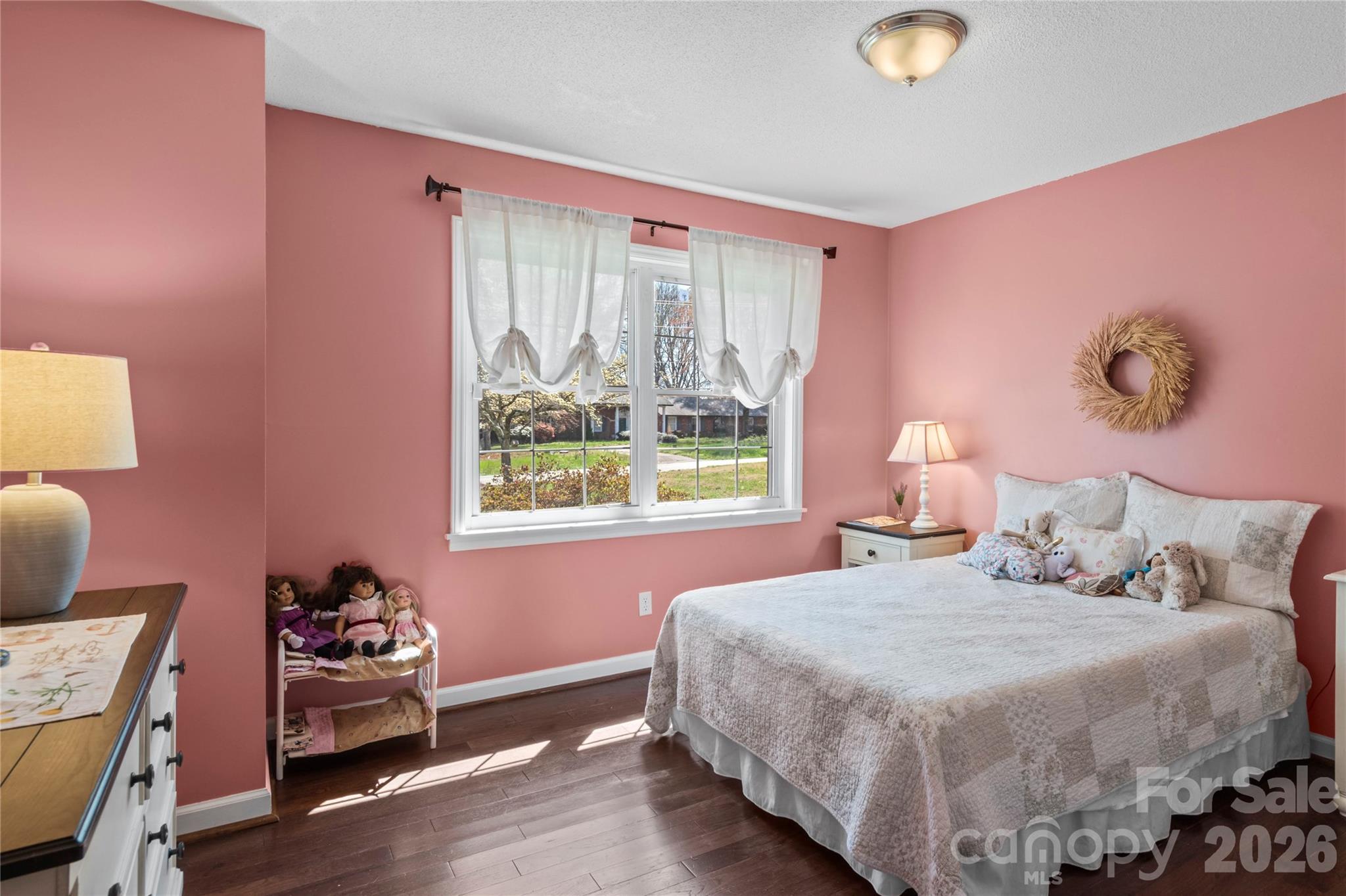 778 Reynolds Road Lewisville, NC 27023 - Photo 21 of 33 a bedroom with a bed and wooden floor