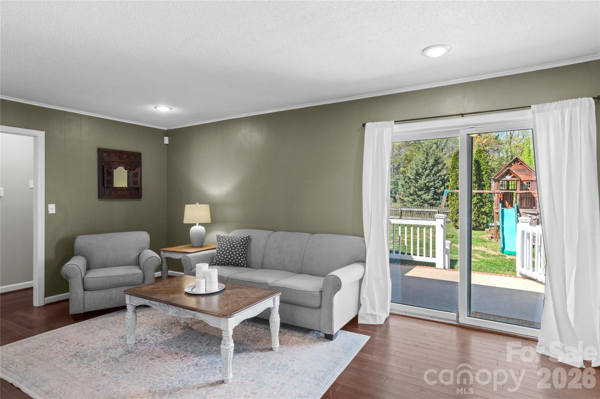 778 Reynolds Road Lewisville, NC 27023 - Photo 24 of 33 a living room with furniture and a lamp