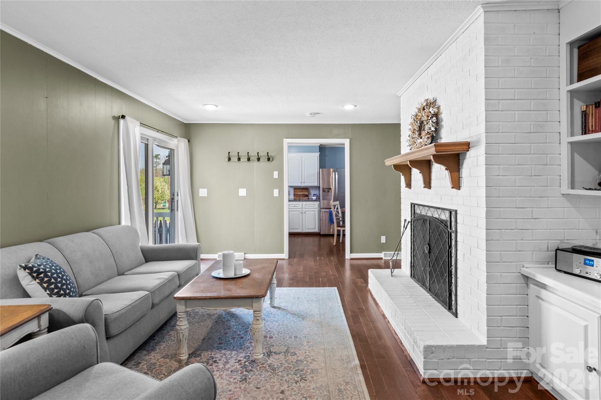 778 Reynolds Road Lewisville, NC 27023 - Photo 25 of 33 a living room with furniture fireplace and a flat screen tv