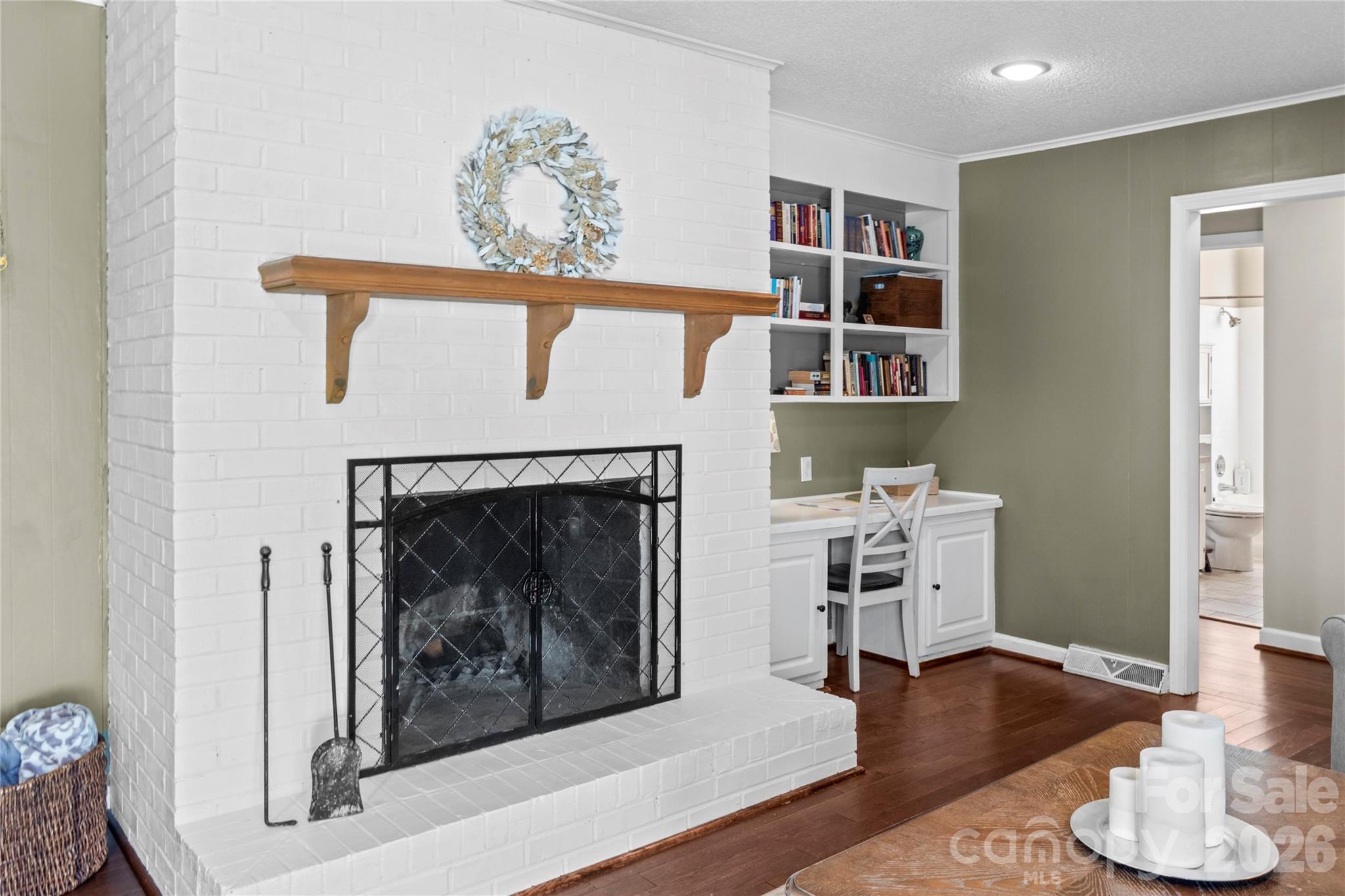 778 Reynolds Road Lewisville, NC 27023 - Photo 26 of 33 a living room with furniture and a fireplace