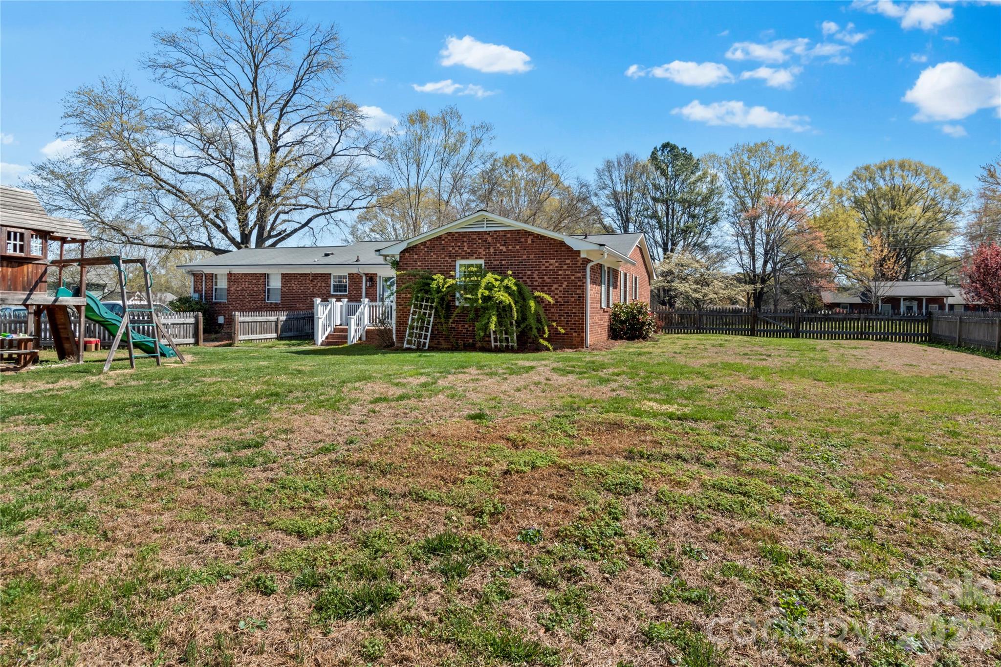 778 Reynolds Road Lewisville, NC 27023 - Photo 31 of 33 a view of a yard with plants and a tree