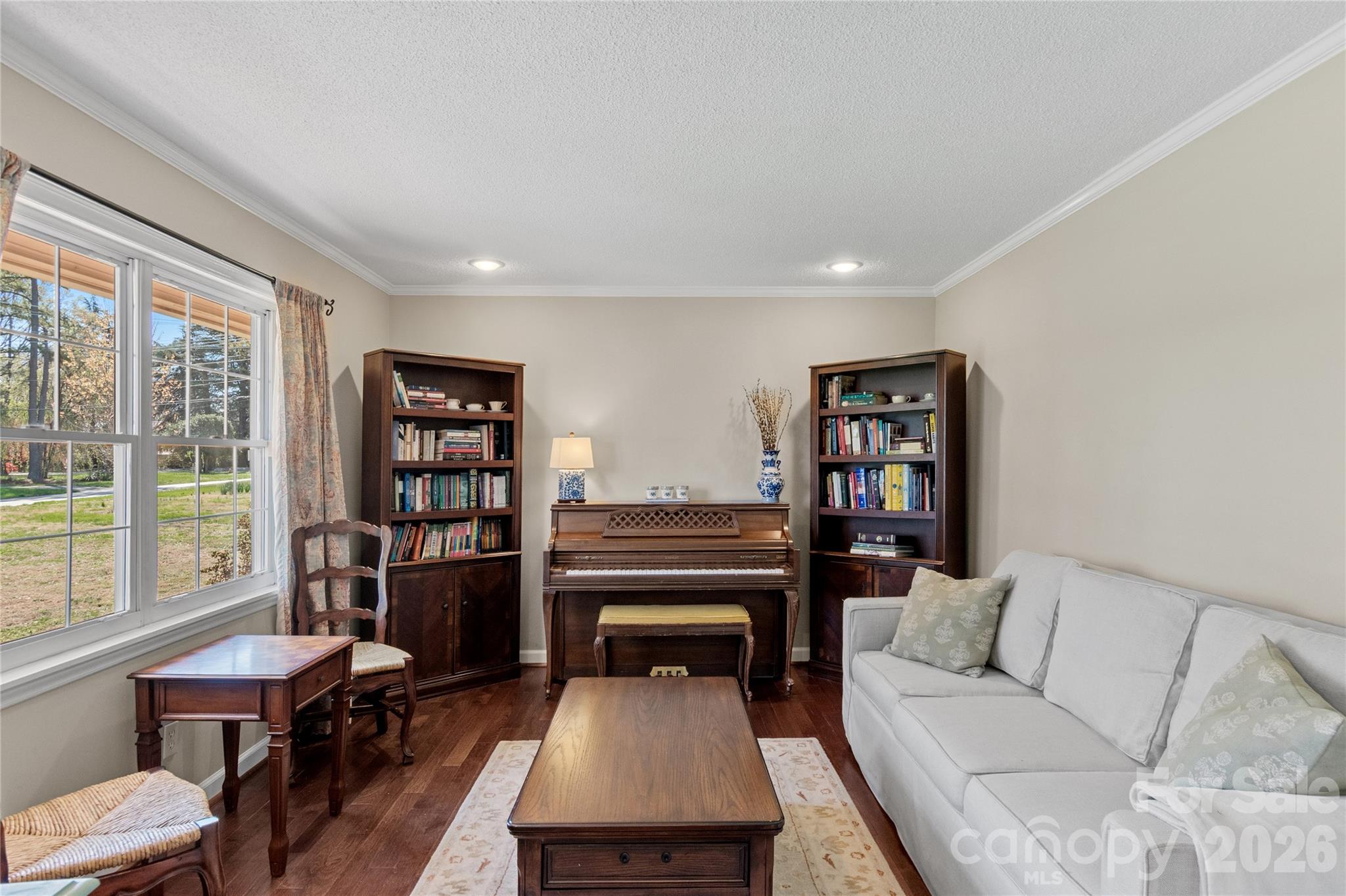 778 Reynolds Road Lewisville, NC 27023 - Photo 5 of 33 a living room with furniture a rug and a large window
