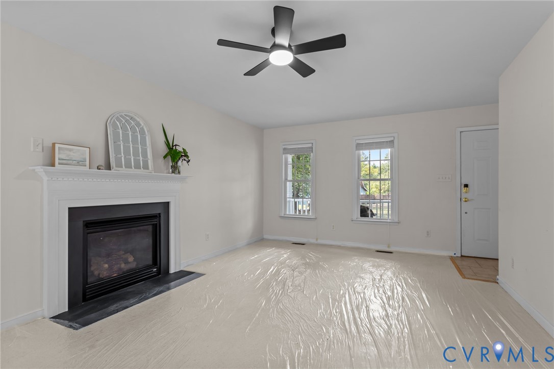 5211 Alberta Road Chesterfield, VA 23832 - Photo 11 of 43 a view of empty room with fireplace and windows