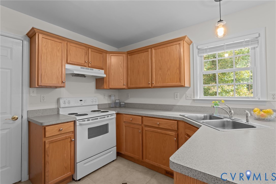 5211 Alberta Road Chesterfield, VA 23832 - Photo 14 of 43 a kitchen with a sink stove and cabinets