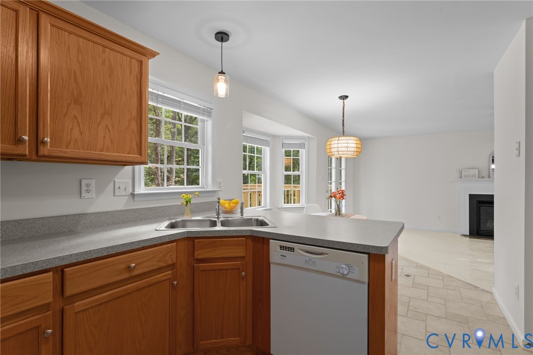 5211 Alberta Road Chesterfield, VA 23832 - Photo 15 of 43 a kitchen with a sink dishwasher a stove and a refrigerator with wooden floor