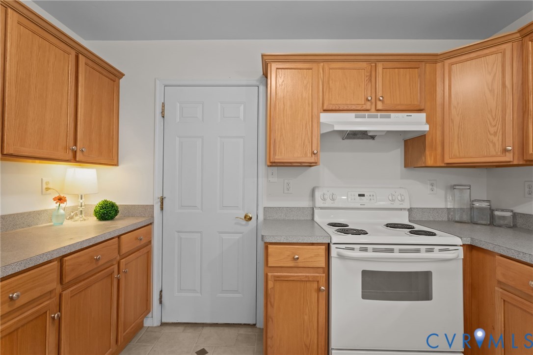 5211 Alberta Road Chesterfield, VA 23832 - Photo 16 of 43 a kitchen with stainless steel appliances granite countertop a sink stove and cabinets
