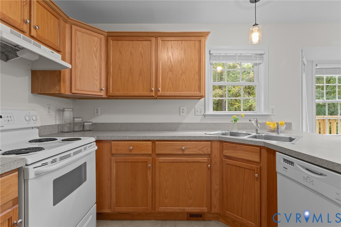 5211 Alberta Road Chesterfield, VA 23832 - Photo 18 of 43 a kitchen with stainless steel appliances granite countertop a sink stove and cabinets