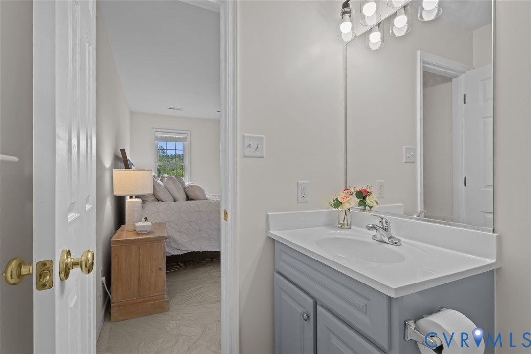 5211 Alberta Road Chesterfield, VA 23832 - Photo 29 of 43 a bathroom with a sink vanity and a mirror