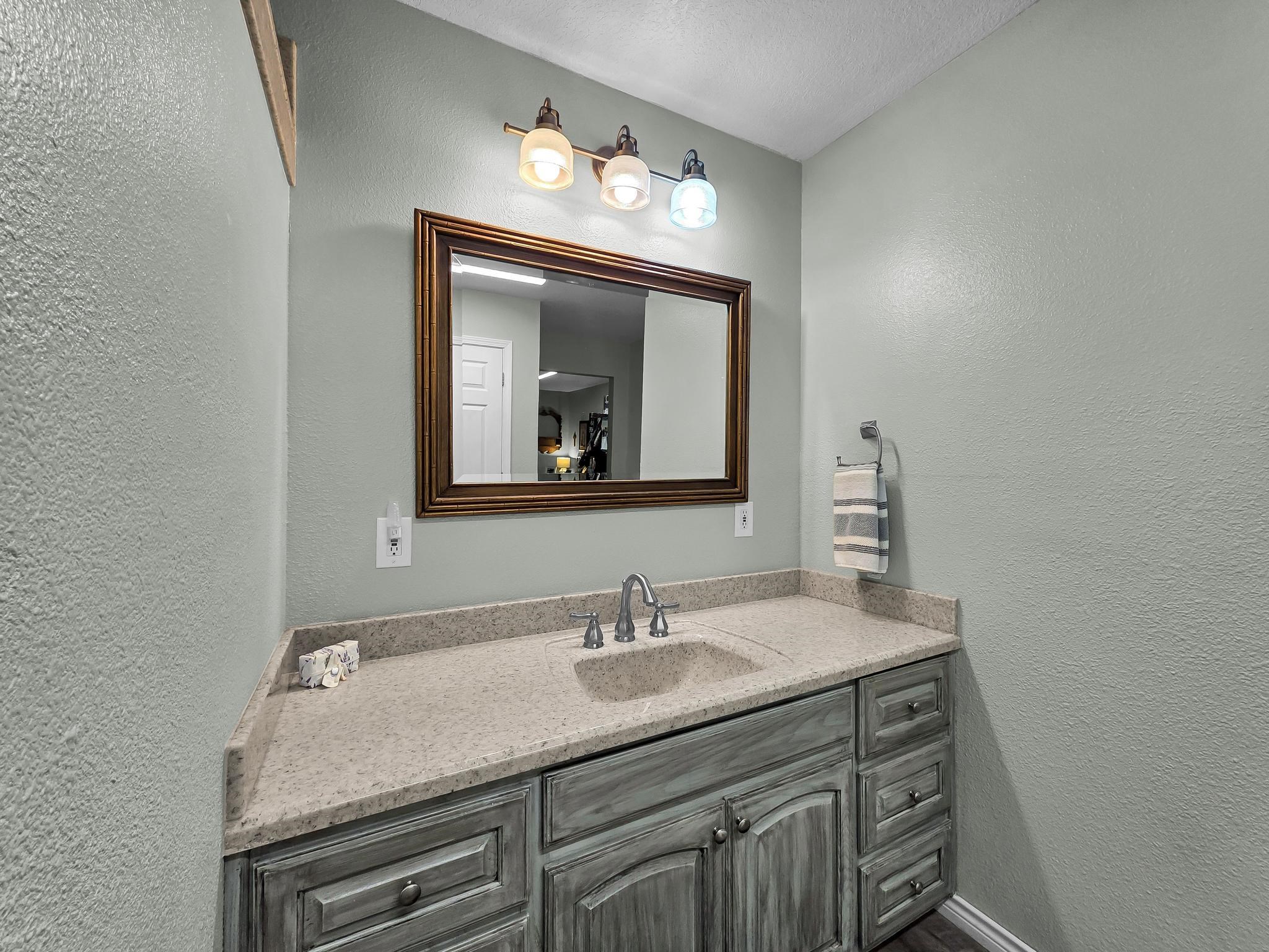 738 Parish Road Orange, TX 77632 - Photo 33 of 45 a bathroom with a sink double vanity and a mirror