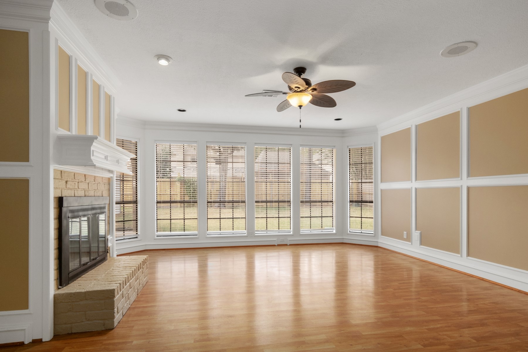 6039 Spring Creek Lane Spring, TX 77379 - Photo 12 of 48 a view of empty room with wooden floor and fan
