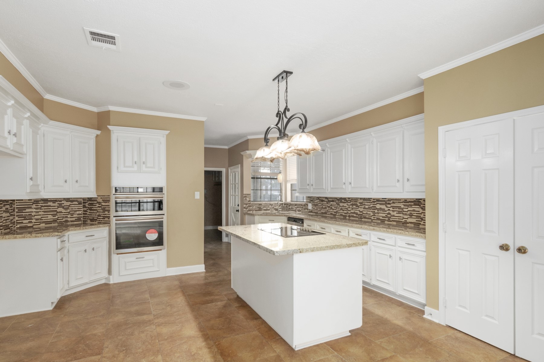 6039 Spring Creek Lane Spring, TX 77379 - Photo 16 of 48 a kitchen with a sink stove and cabinets