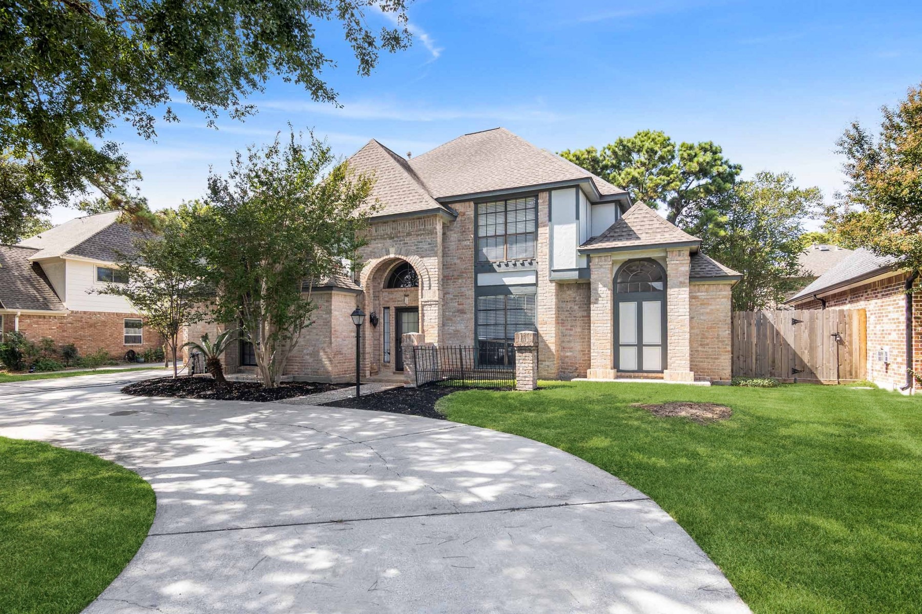 6039 Spring Creek Lane Spring, TX 77379 - Photo 2 of 48 a front view of a house with a yard