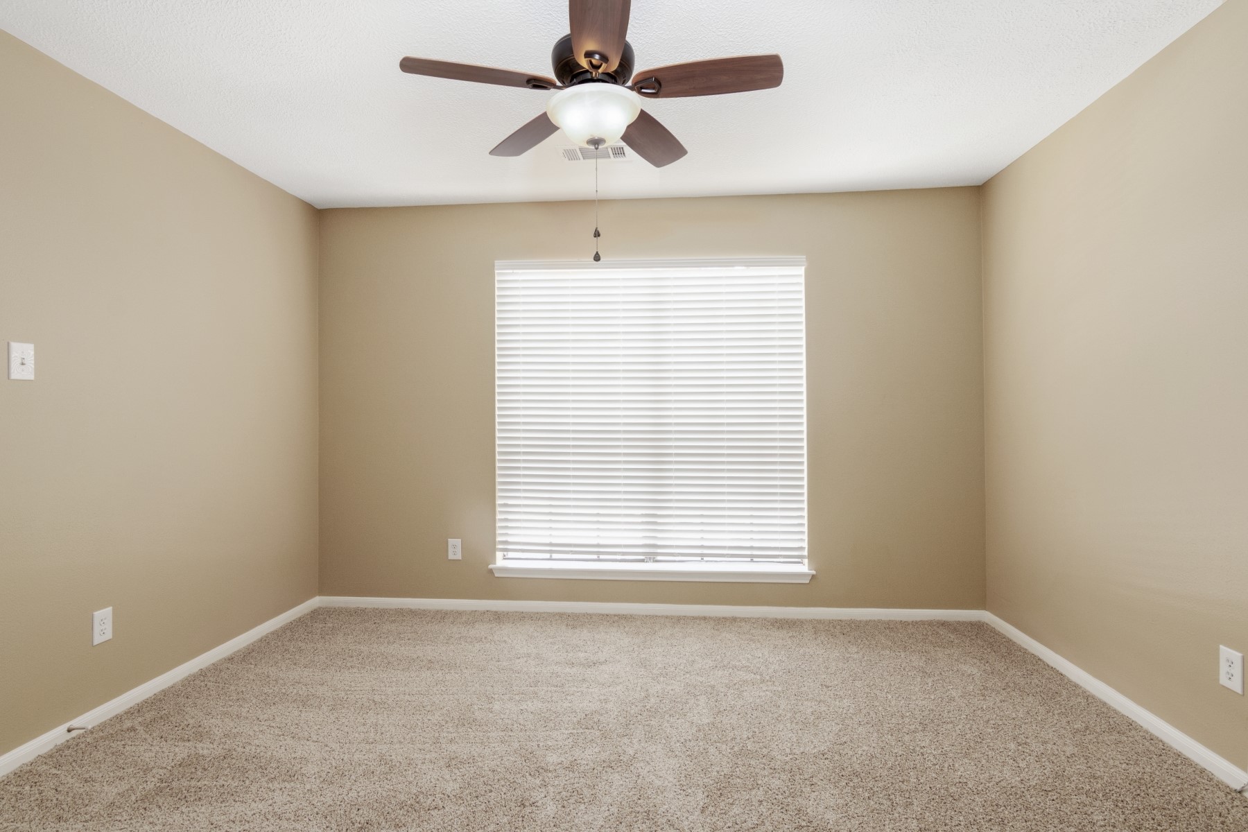 6039 Spring Creek Lane Spring, TX 77379 - Photo 24 of 48 an empty room with a window and a fan